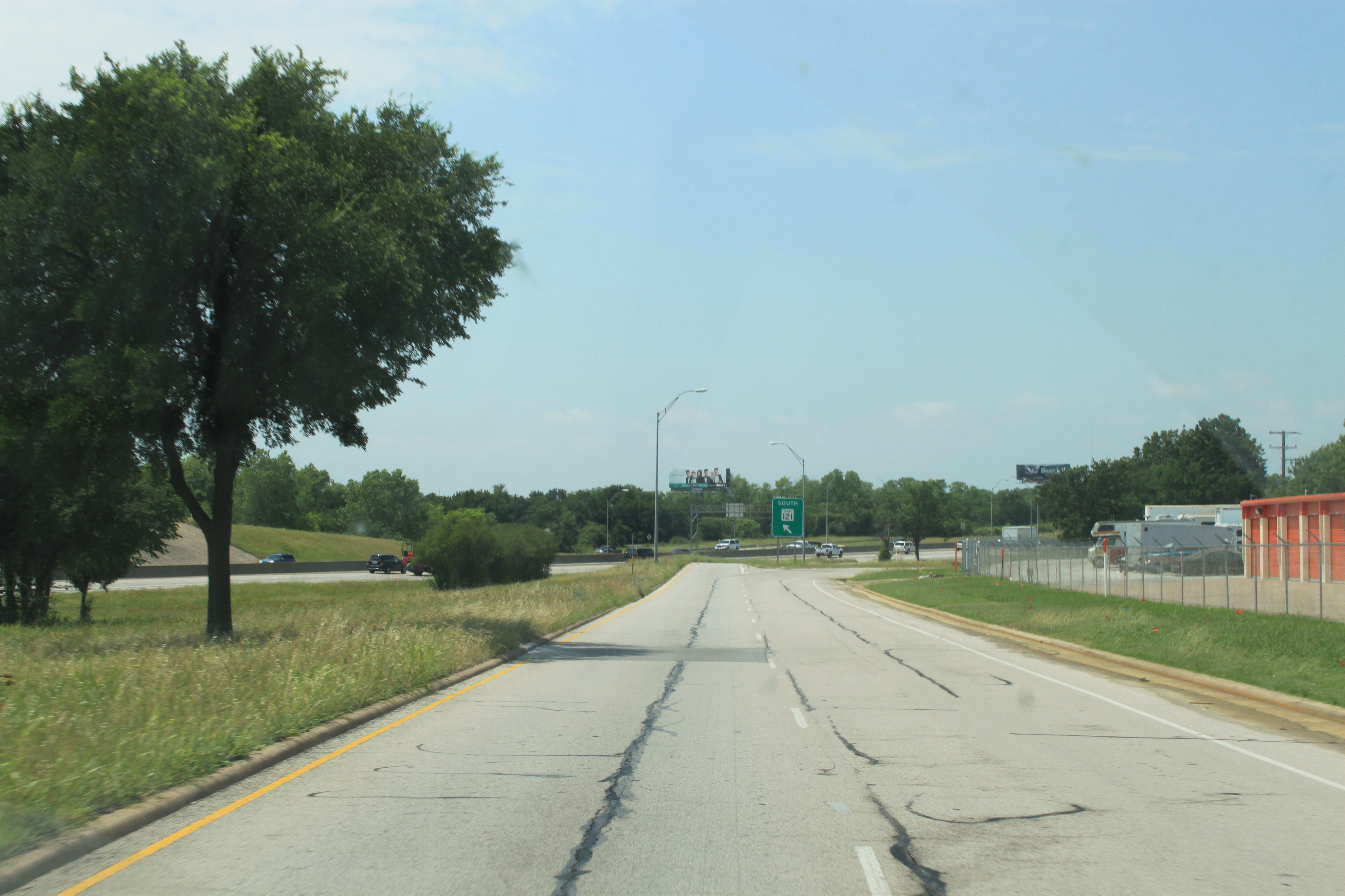 SH 121 southbound frontage road south of Hurst Blvd. Entrance ramp to SH 121 in background.
