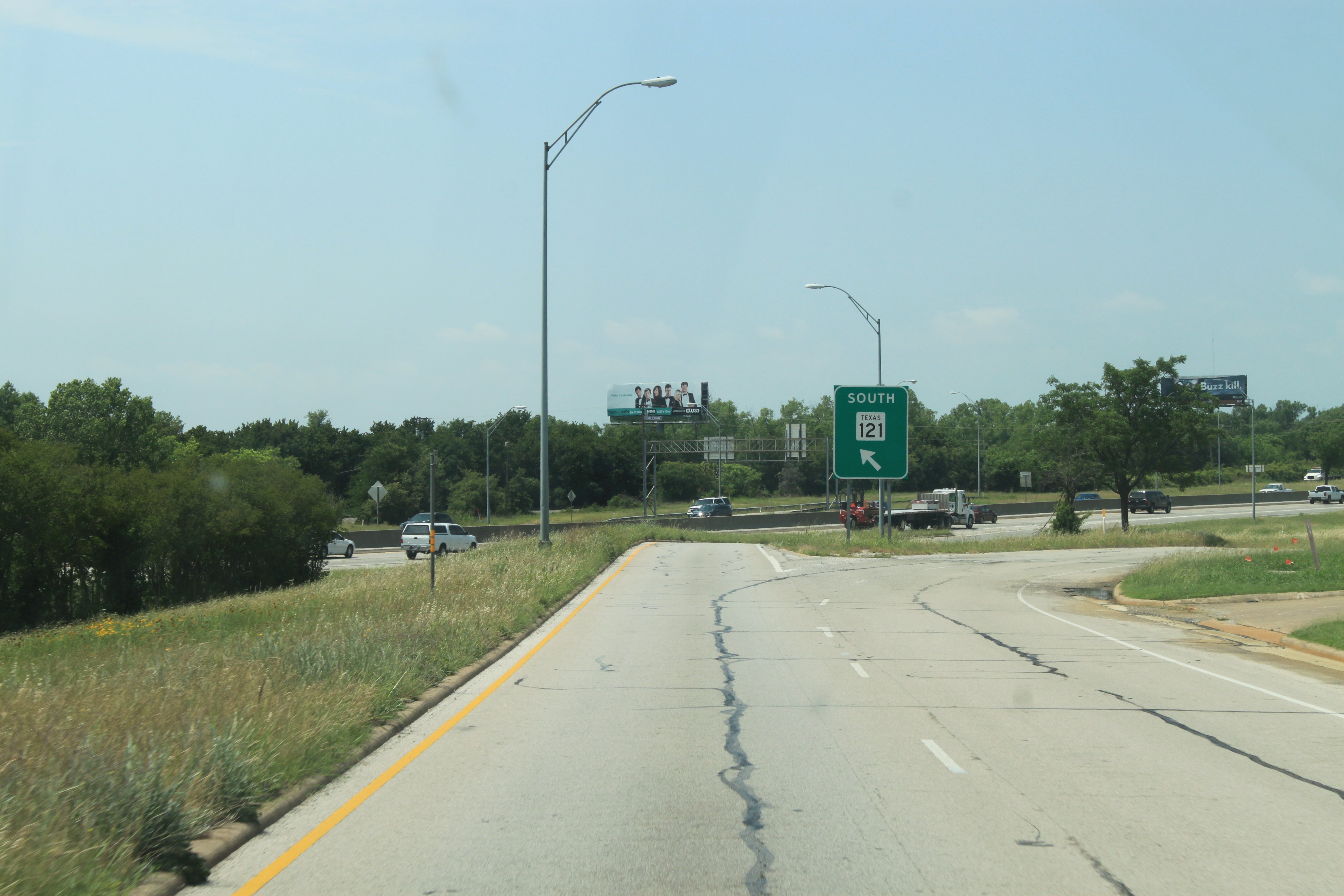 SH 121 southbound frontage road north of Handley Ederville Rd showing entrance ramp to highway.