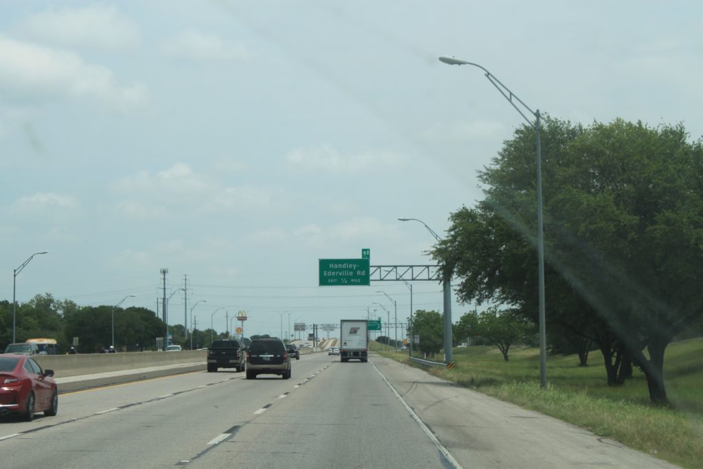 SH 121 northbound south of Handley Ederville Rd showing exit sign for Handley Ederville Rd