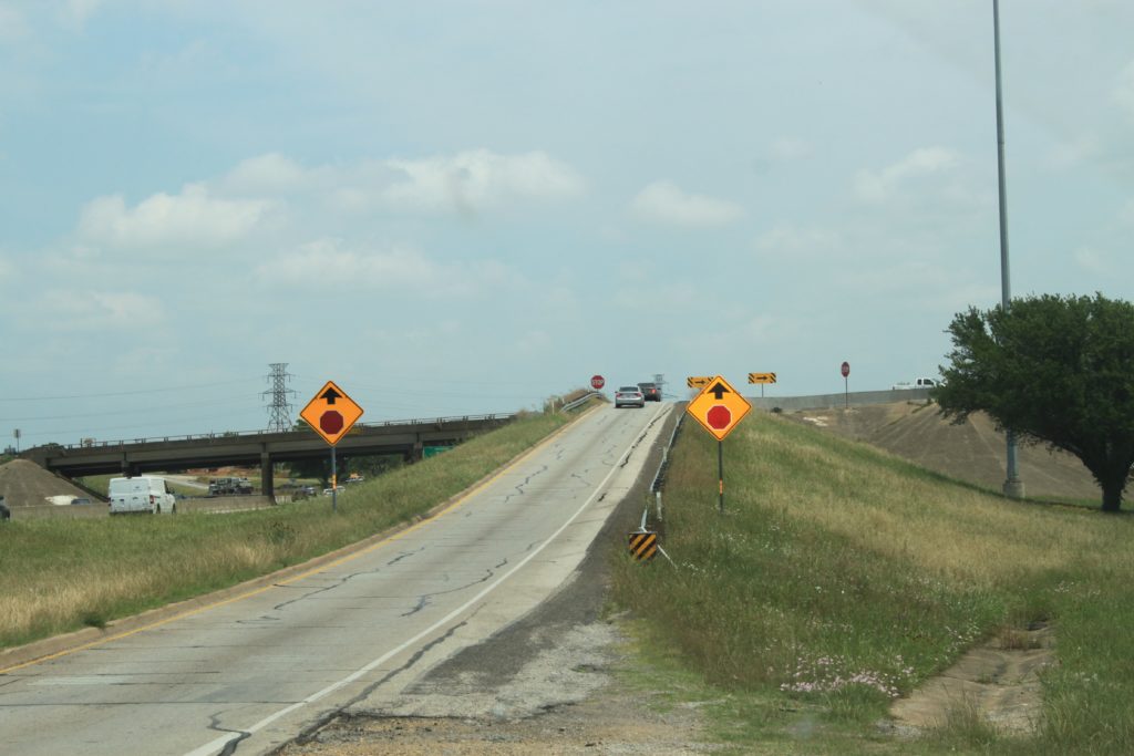 SH 121 northbound  access ramp to I-820 southbound access ramp. Double STOP warning signs are in foreground.
