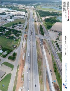 SH 121 looking northeast at Handley-Ederville Rd interchange. New northbound frontage road construction seen south of SH 121.