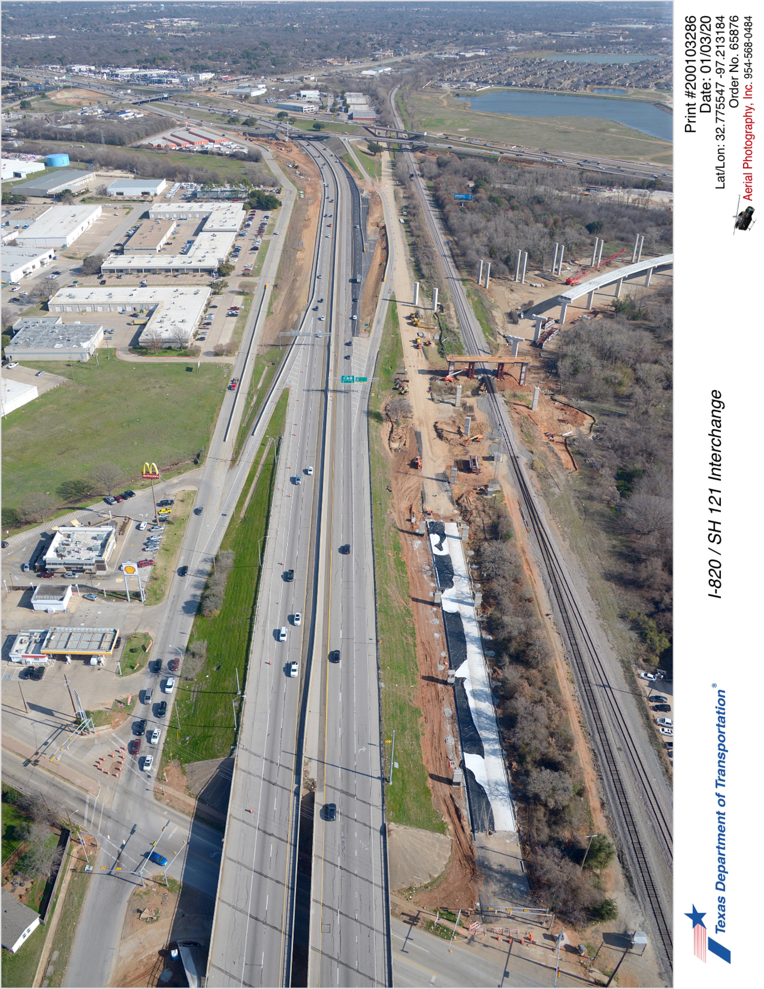 SH 121 looking northeast over Handley-Ederville Rd in foreground. Construction shown on northbound frontage road east of Handley-Ederville Rd and direct connector construction over the Trinity Railway Express line.