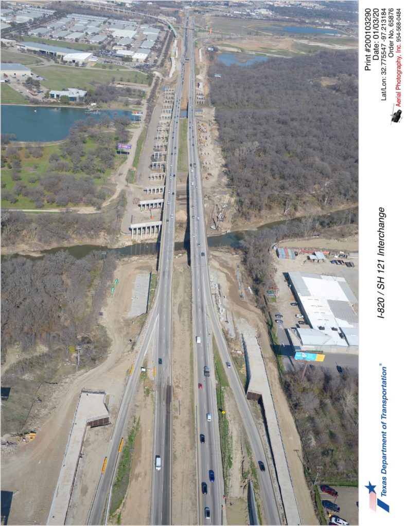 I-820 looking north over Randol Mill Rd with Trinity River crossing in mid-ground. Construction of southbound bridge over Trinity River is shown on the west side.