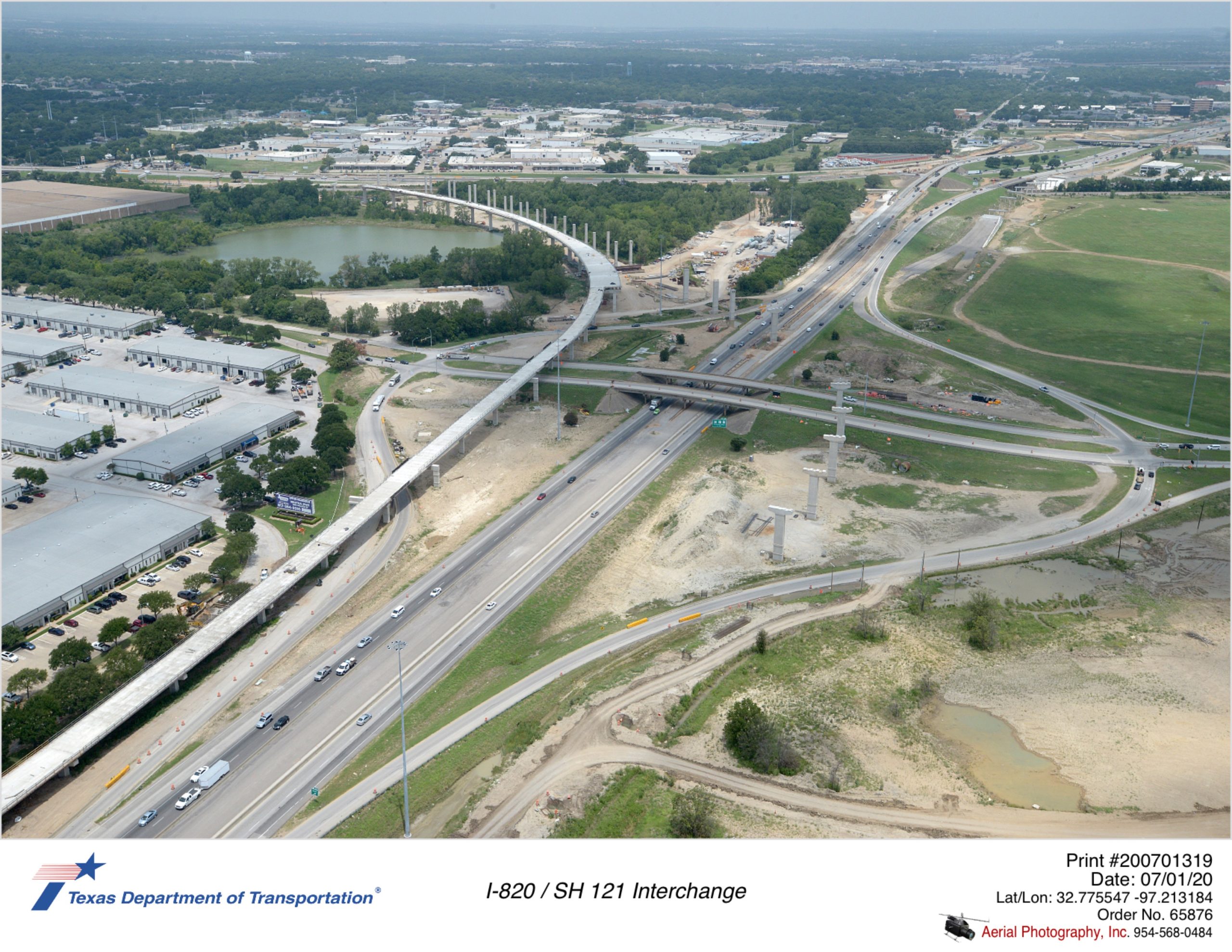 Looking northwest at I-820/Trinity Blvd interchange. Construction of new direct connector bridge to SH 1121 shown.