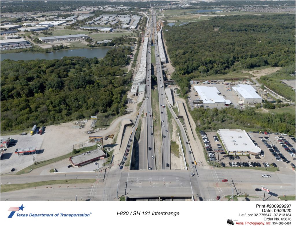 I-820 looking north over Randol Mill Rd interchange. Construction of new north and southbound bridges over Trinity River basin is shown. Work on new ramps north of Ranol Mill Rd is shown.