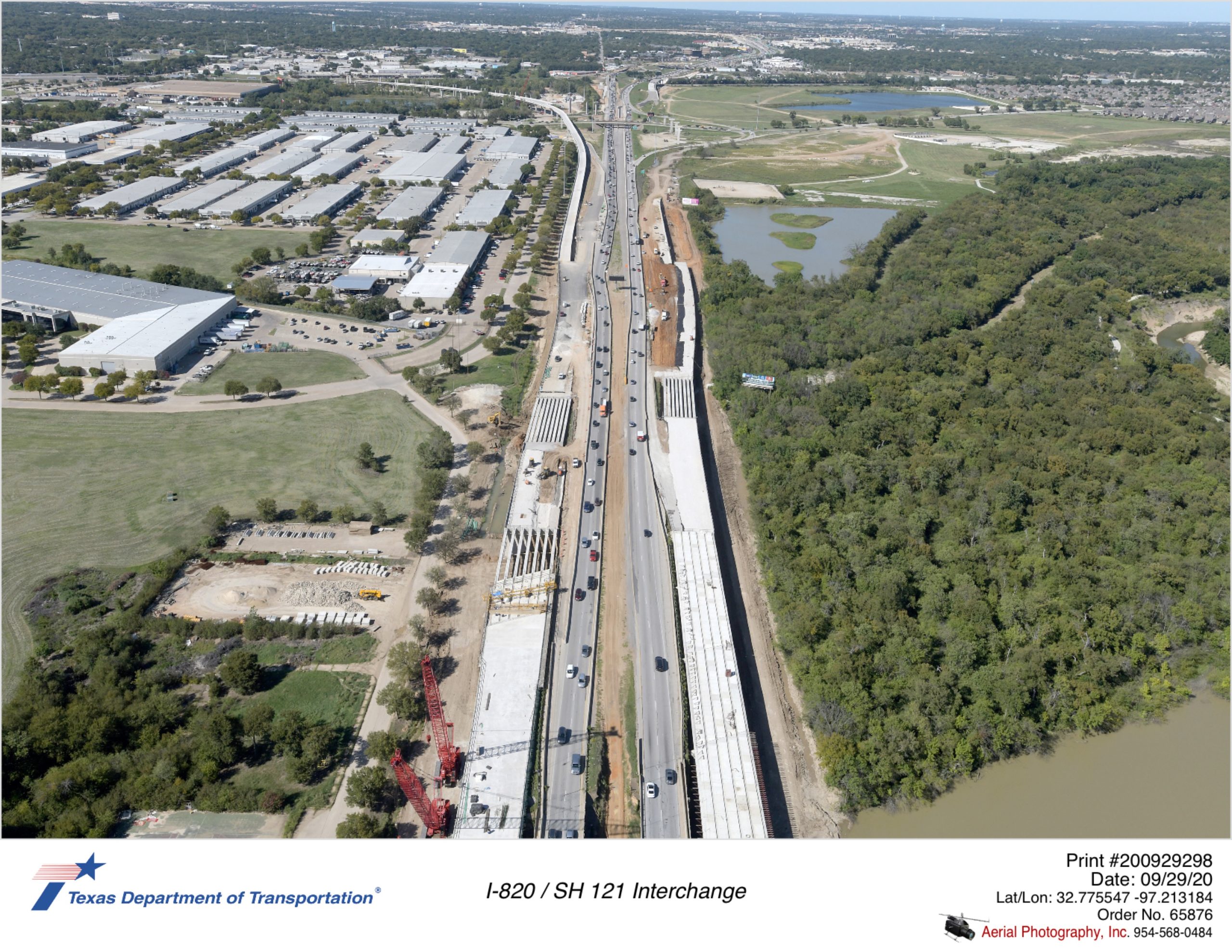 I-820 looking north over Trinity River. Bridge structures for new north and southbound I-820 shown constructed on outside of existing lanes.