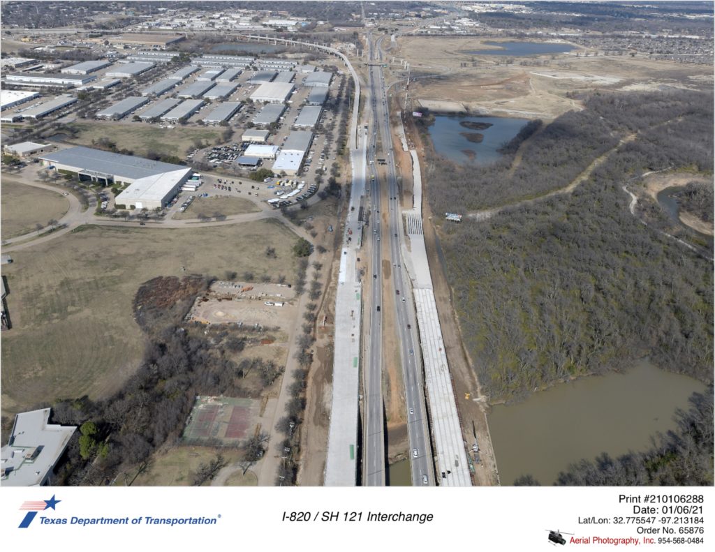 I-820 looking north over Trinity River. Construction of new bridges in Trinity River floodplain are shown.