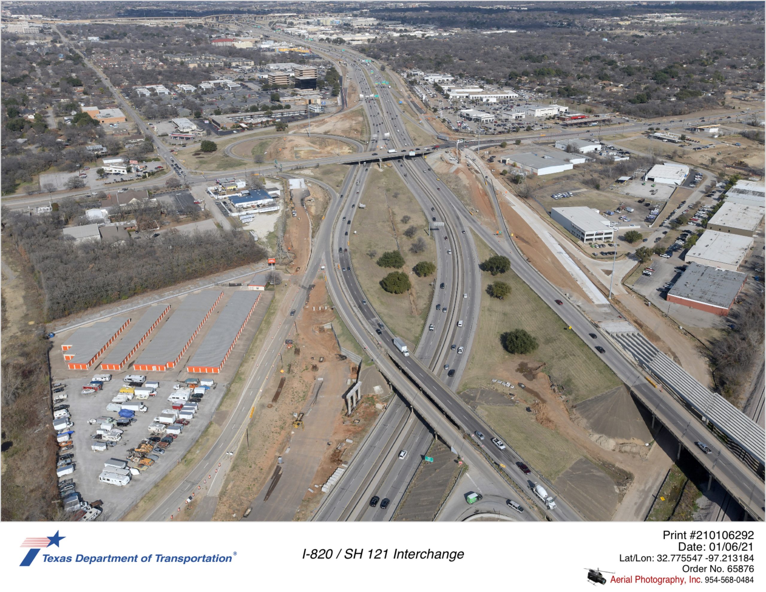 I-820/SH 121 interchange looking north. Construction of new I-820 frontage road north of Trinity Rail Express and new I-820 southbound structure at SH 121 is shown.
