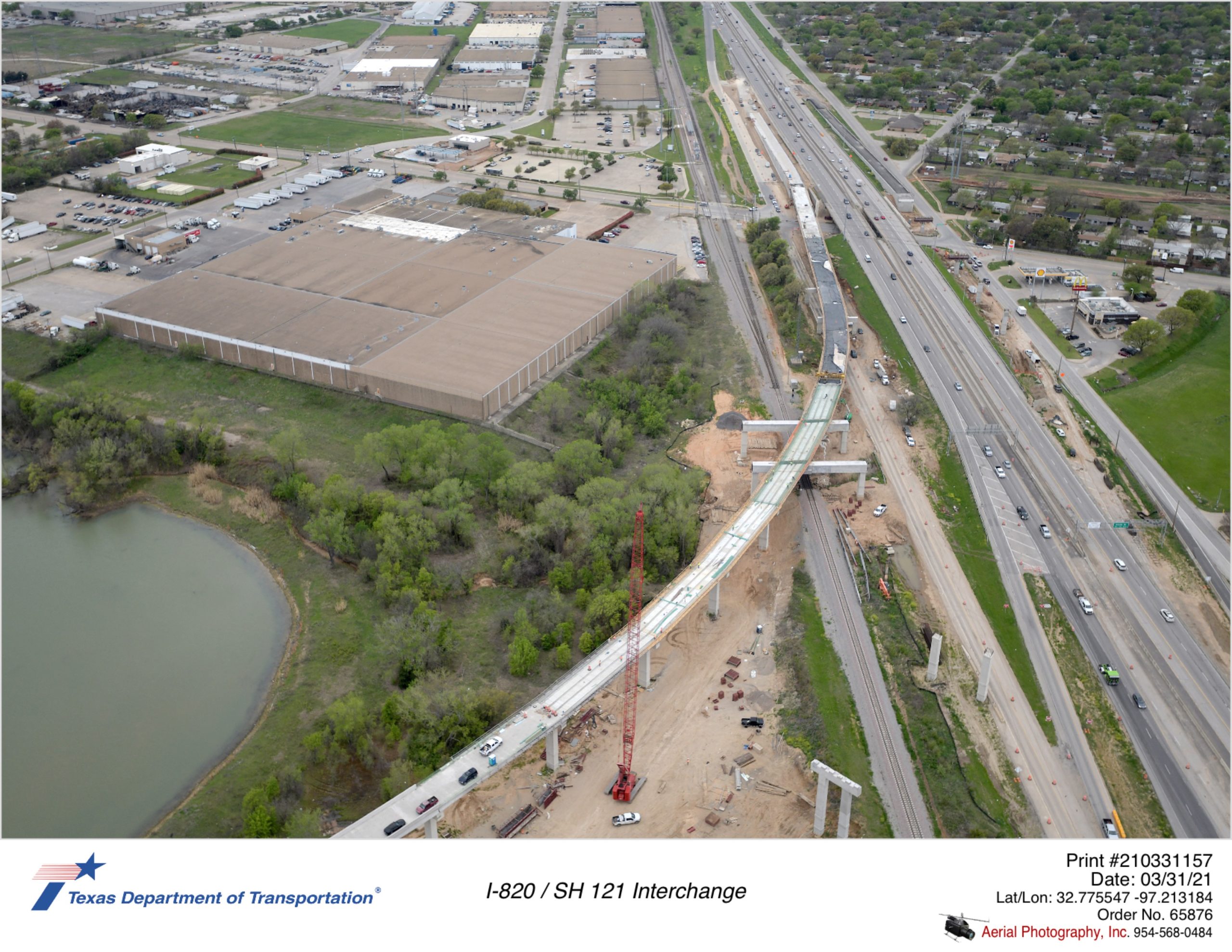 SH 121 looking west at Handley-Ederville Rd interchange focusing on construction of direct connector connections with SH 121 under construction.