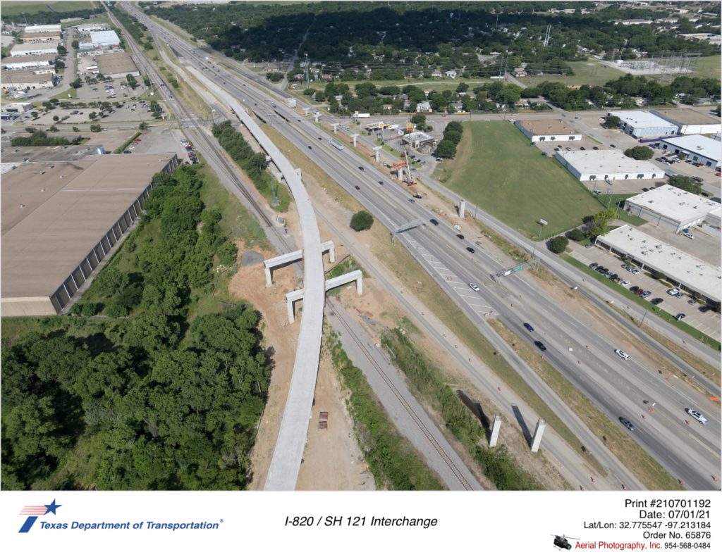 SH 121 looking southwest with Handley-Ederville Rd interchange in background.