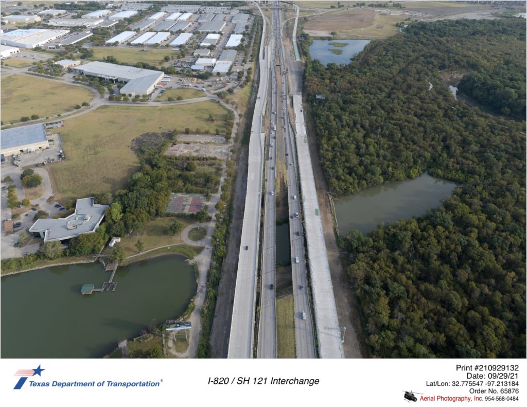 I-820 looking north over Trinity River. Construction of new bridges crossing Trinity River shown.
