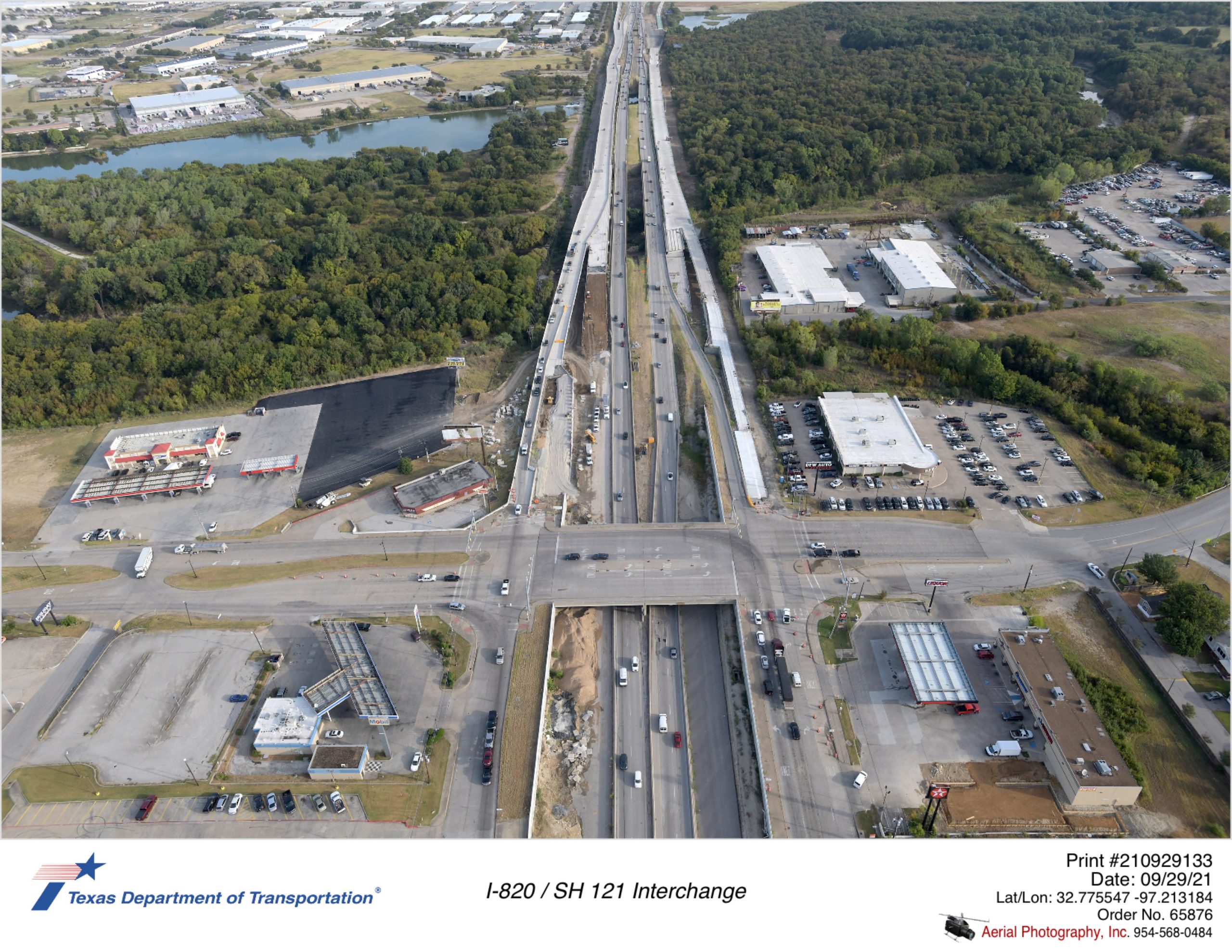 I-820 looking north over Randol Mill Rd interchange shown in foreground. Construction of walls and bridges shown.