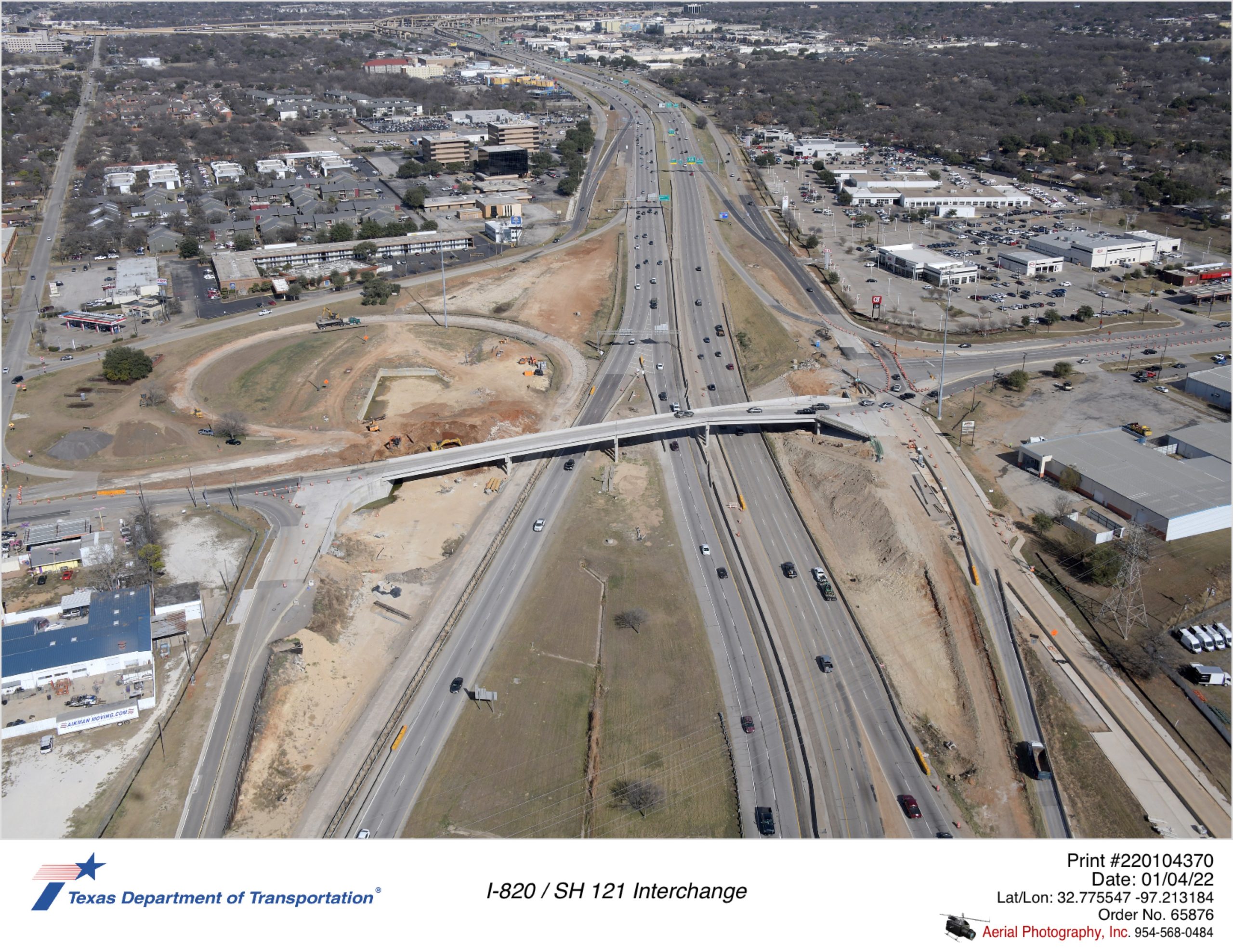 I-820 looking north at SH 10 interchange. Legacy SH 10 bridge is removed. Construction of new SH 10 bridge beginning.