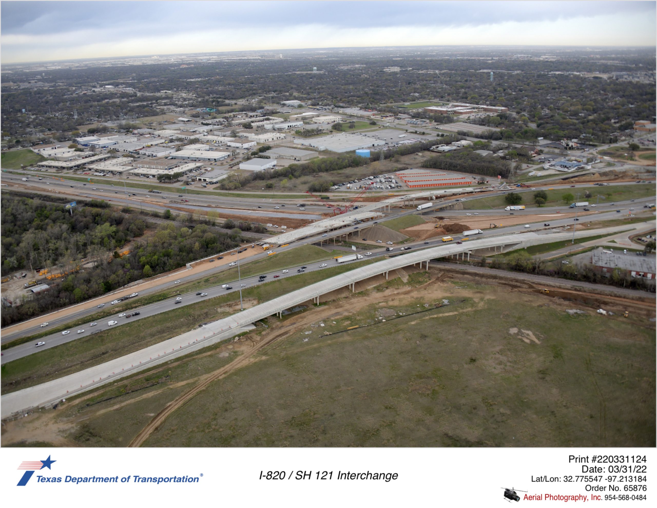 I-820/SH 121 interchange looking northwest.  Progress shown for I-820 southbound frontage road bridge and new northbound frontage road bridge.