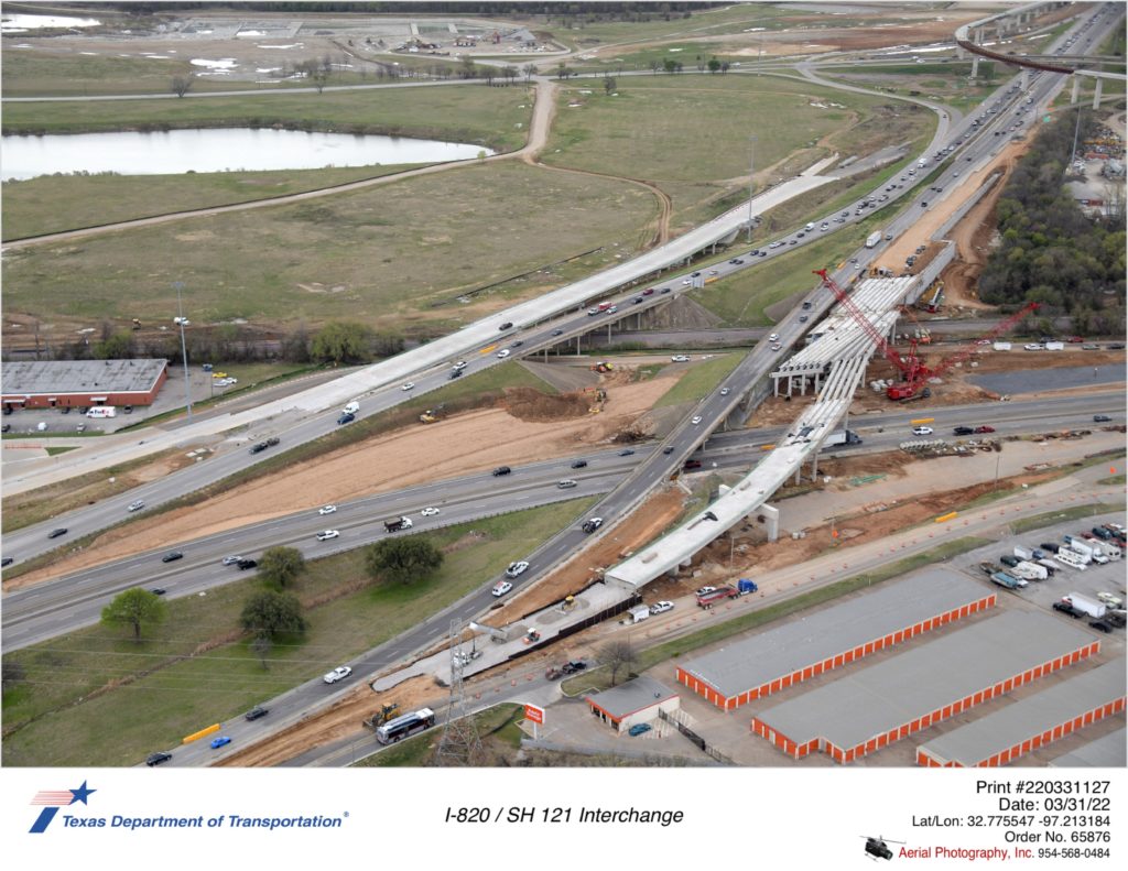 I-820 looking south over SH 10. Focus on I-820 southbound frontage road bridge over SH 121.