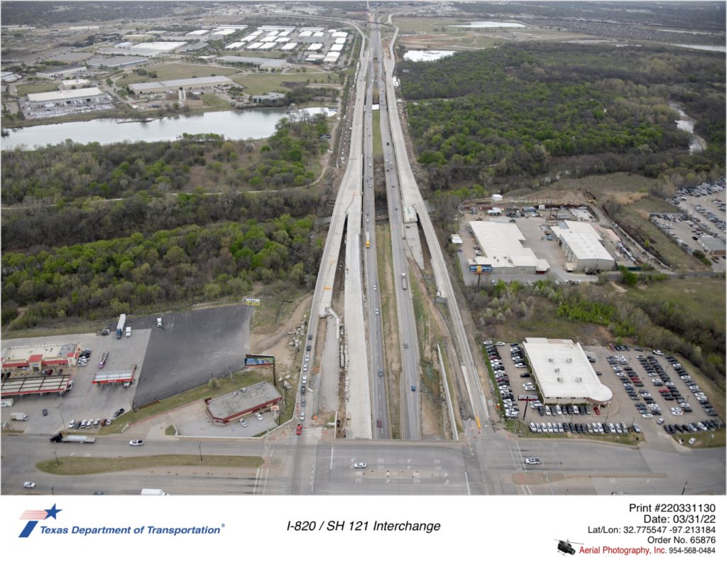 I-820 looking north over Randol Mill Rd. Progress shown on future southbound mainlanes approaching Randol Mill Rd and northbound mainlanes from the Trinity River to the north.