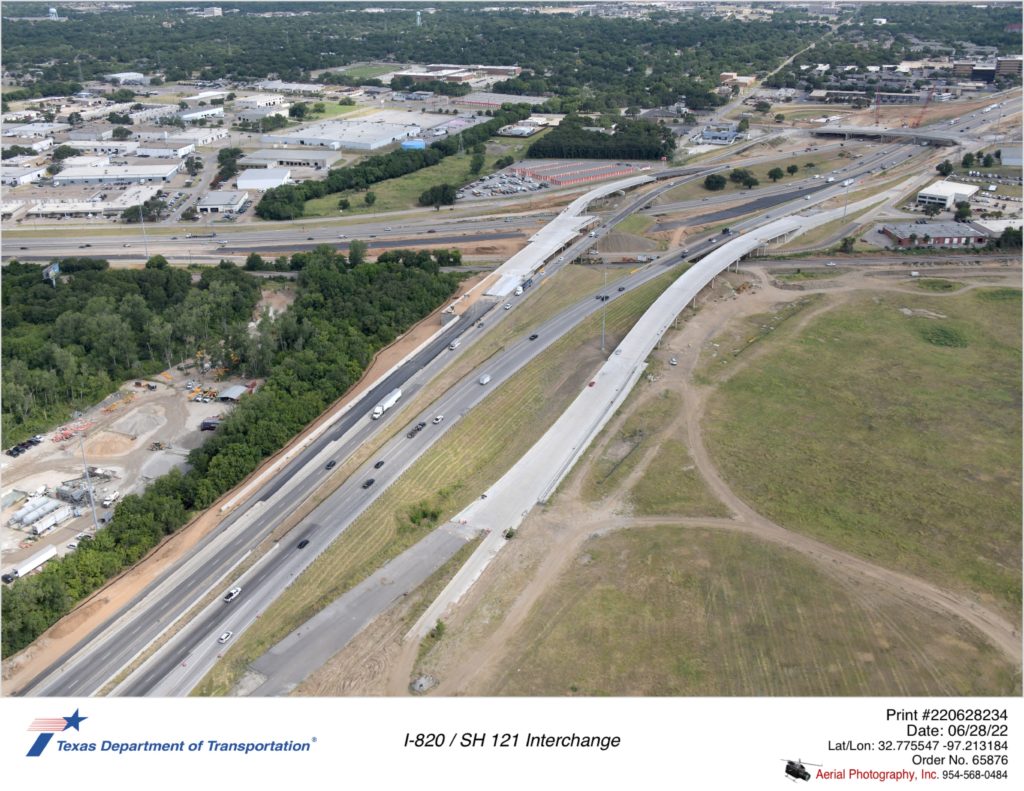 I-820/SH 121 interchange looking northwest. Image shows construction of new I-820 mainlane and frontage road pavement and bridges over SH 121.
