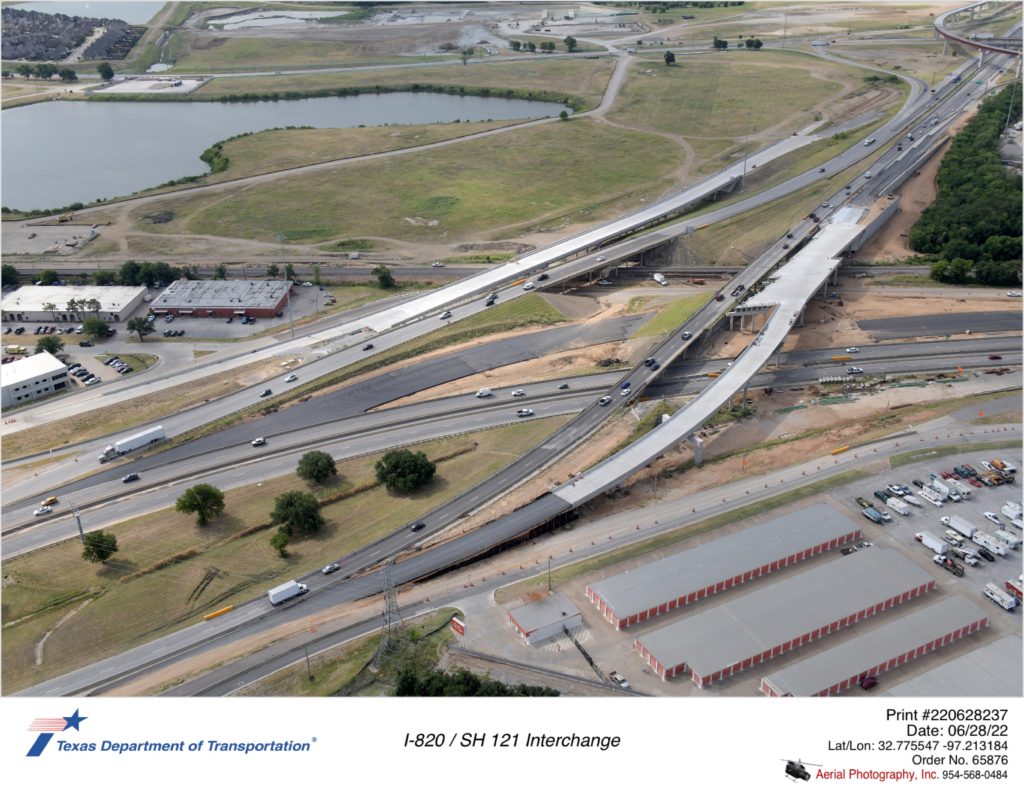 I-820/SH 121 interchange looking southeast. Image shows completion of future permanent southbound frontage road bridge over SH 121 that will temporarily handle mainlane traffic.