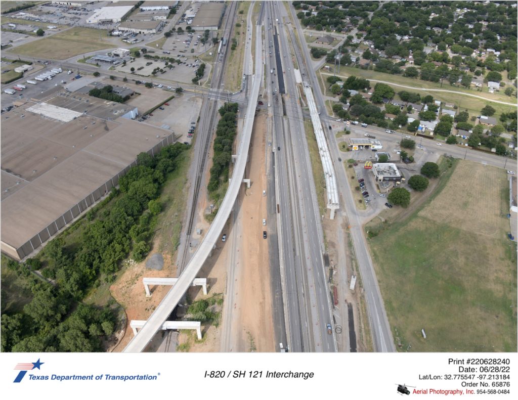SH 121 looking southwest at Handley-Ederville Rd interchange. Image shows partial construction of I-820 north to SH 121 south direct connector ramp.