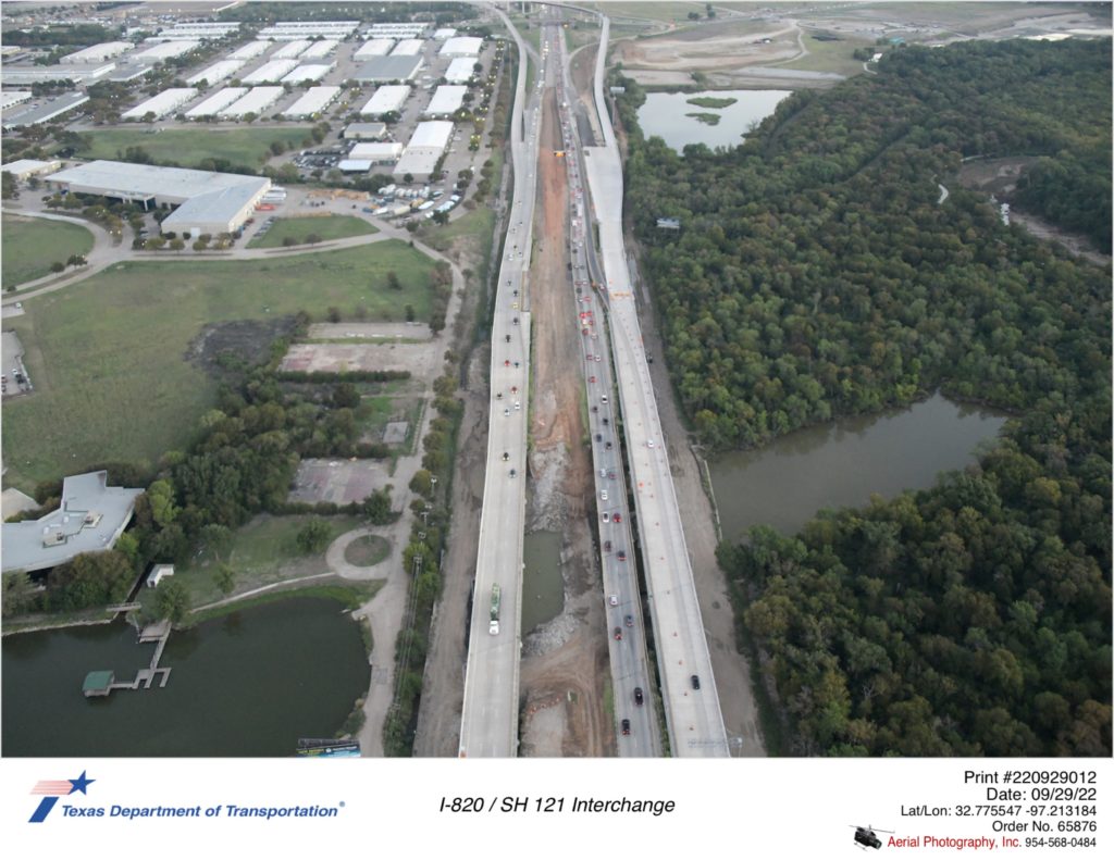I-820 looking north over Trinity River. I-820 bridge removal shown between I-820 traffic.