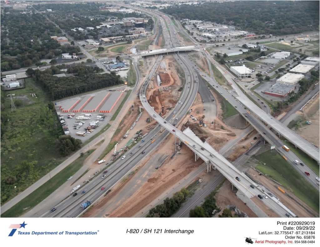 I-820/SH 121 interchange. Excavation and substructure work shown east of I-820 south traffic.