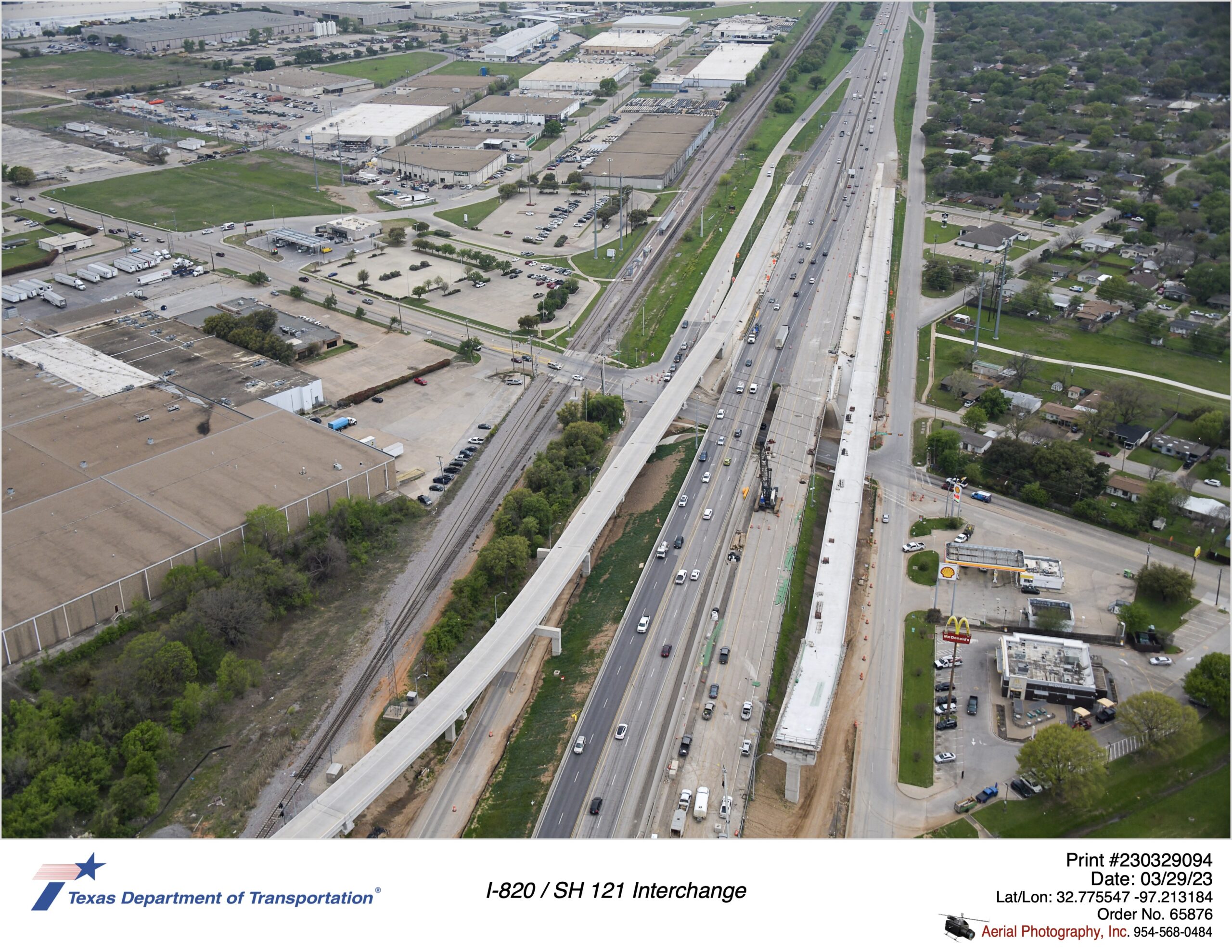 SH 121 looking south over Handley-Ederville Rd interchange highlighting new direct connector ramps connecting to SH 121. March 2023.
