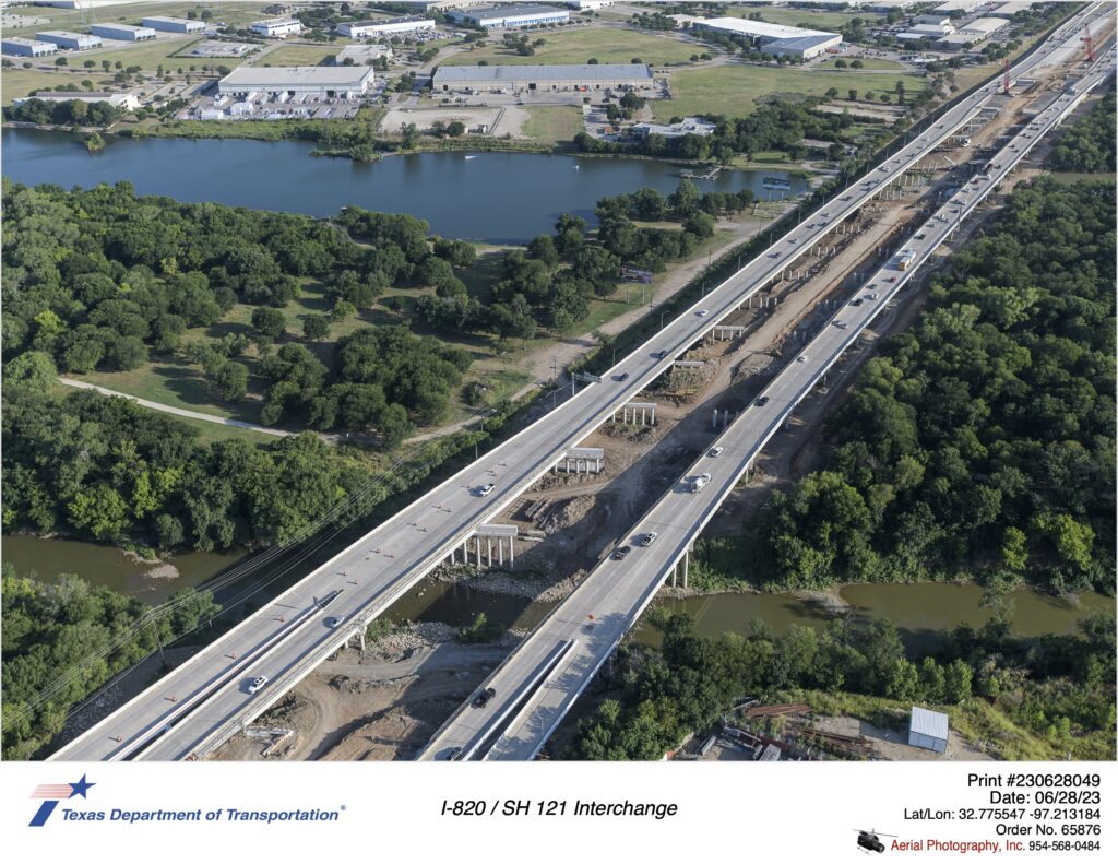 I-820 looking northwest over Trinity River. Image shows construction of interior mainlane bridge structures.