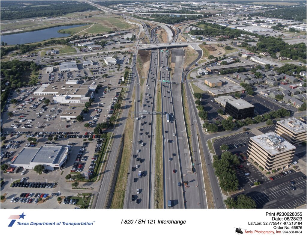 I-820 looking south at SH 10 interchange. Image shows construction of new southbound frontage road and southbound mainlanes.