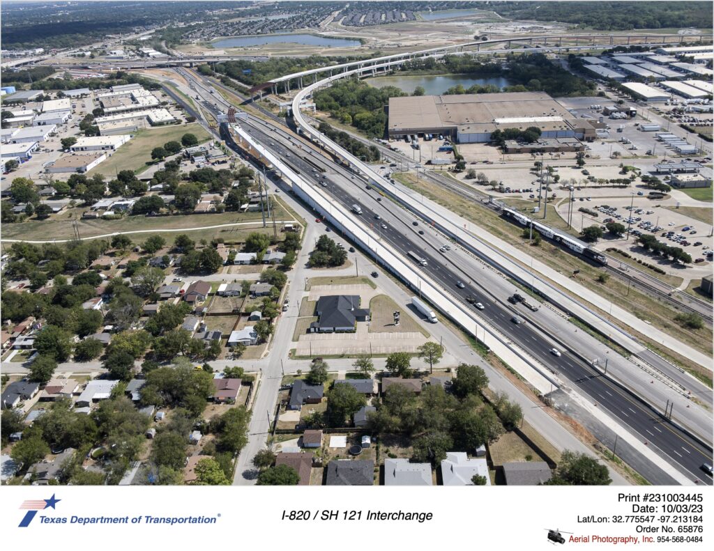 SH 121 looking east at Handley-Ederville Rd interchange and direct connectors to and from I-820. October 2023.